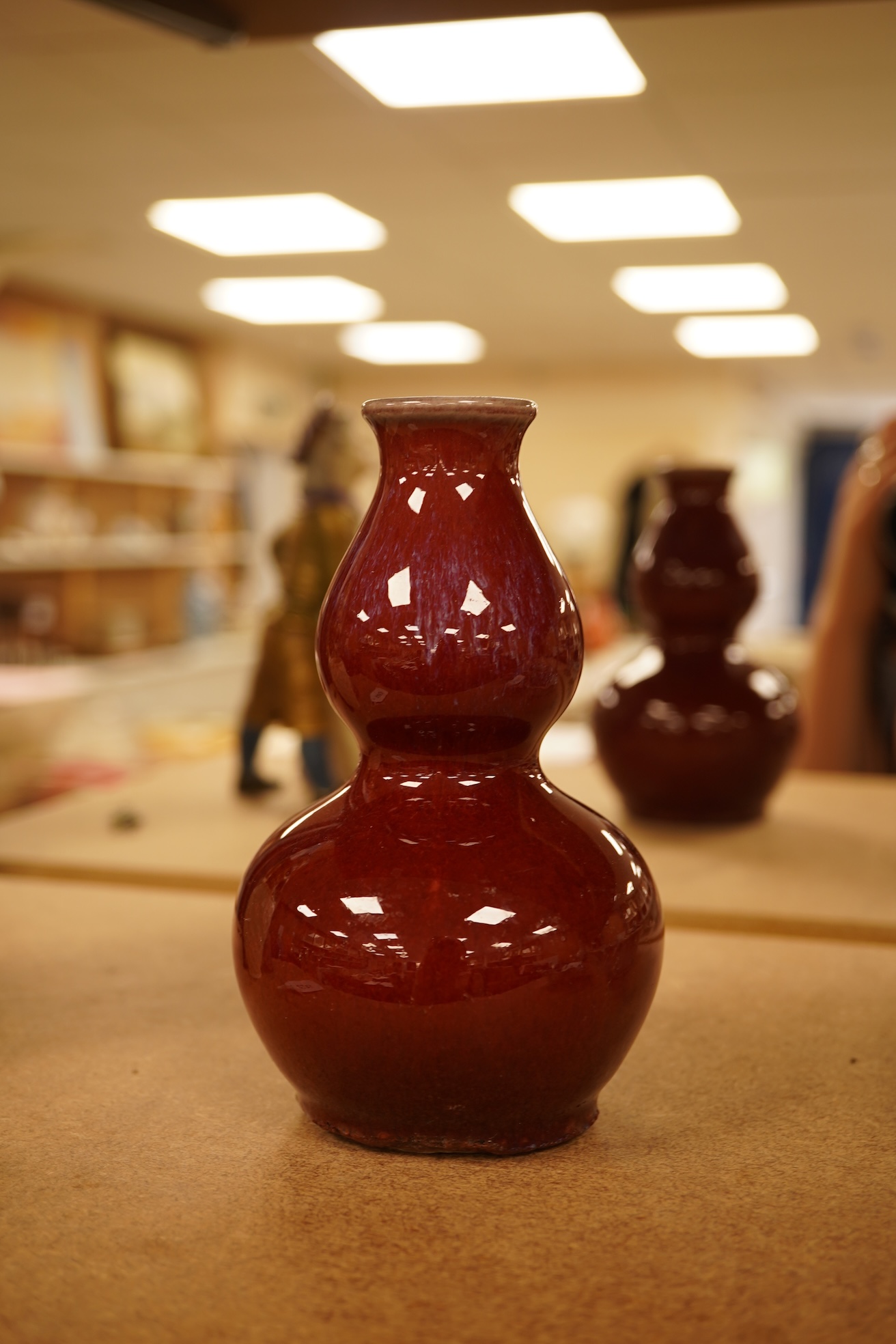 A Chinese Sang De Boeuf glazed double gourd vase, 14.5cm high